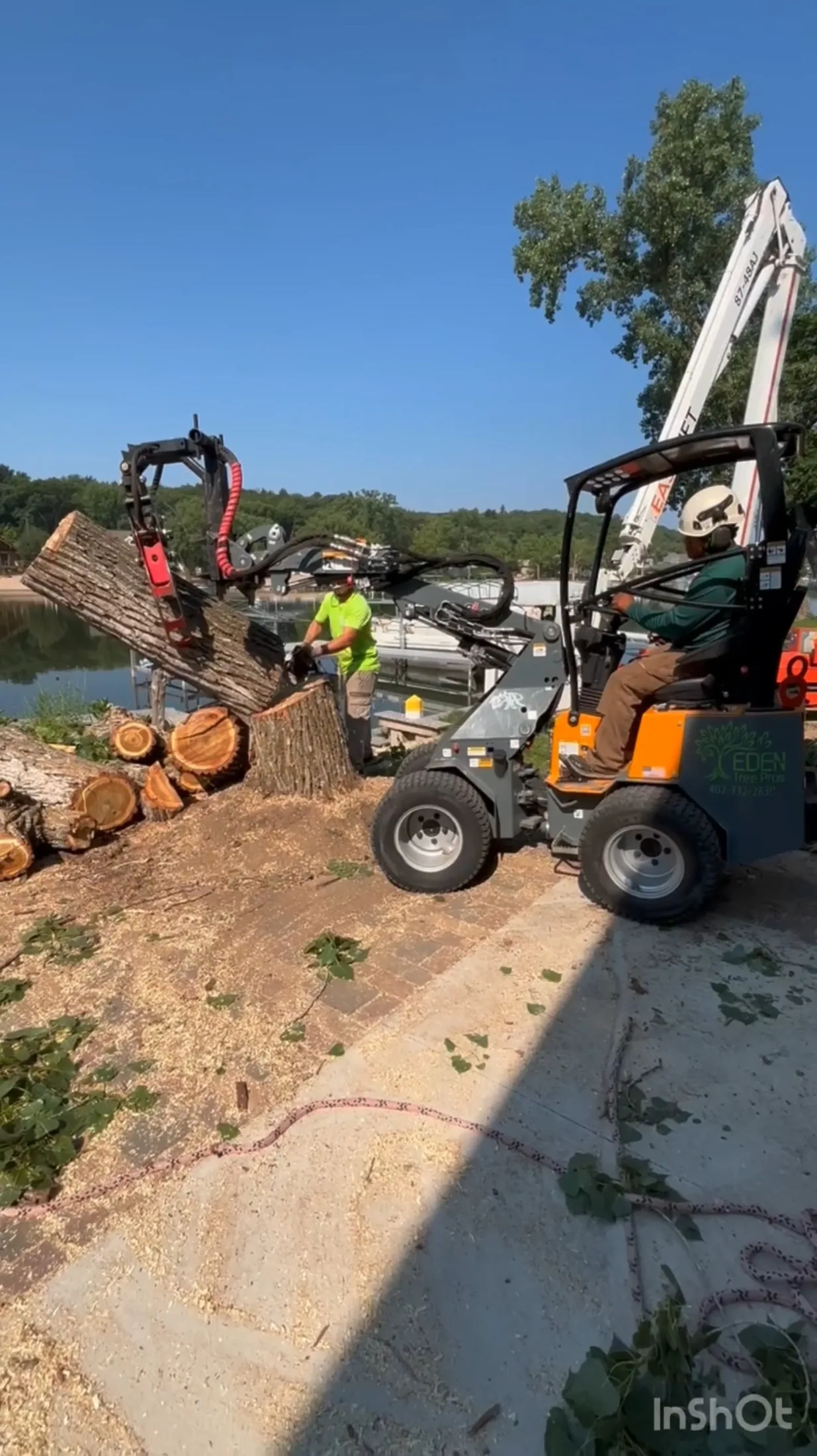Eden Tree Pros crew clearing a storm-damaged tree from an Omaha home